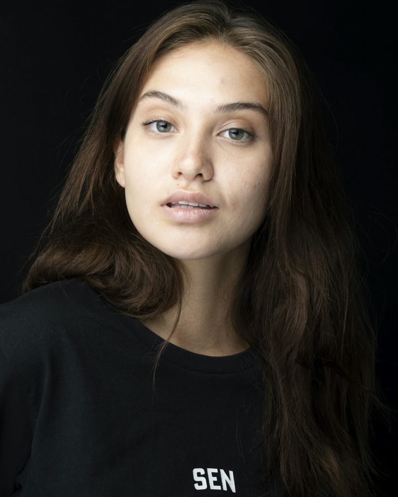 Woman with long hair, casual shirt